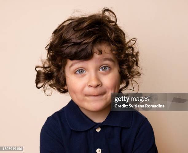 portrait of surprised grimacing child - boy young cute stock-fotos und bilder