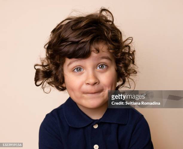 portrait of surprised grimacing child - boy funny face ストックフォトと画��像