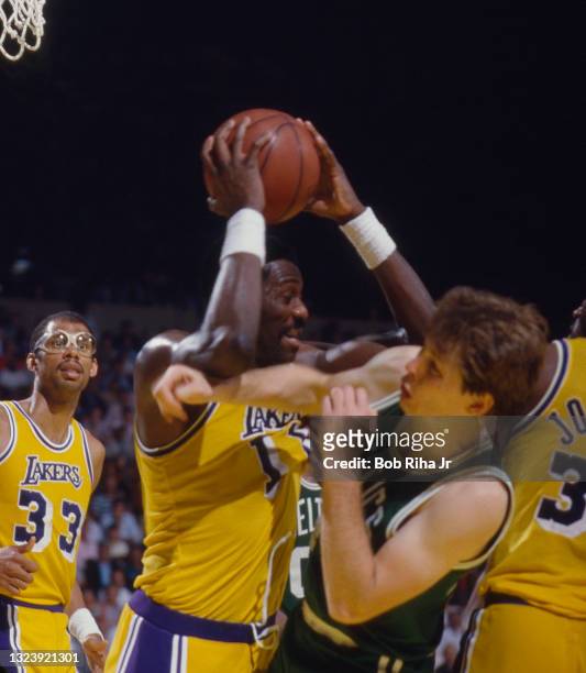 Los Angeles Lakers Bob McAdoo battles for rebound with Boston Celtics Danny Ainge during 1985 NBA Finals between Los Angeles Lakers and Boston...
