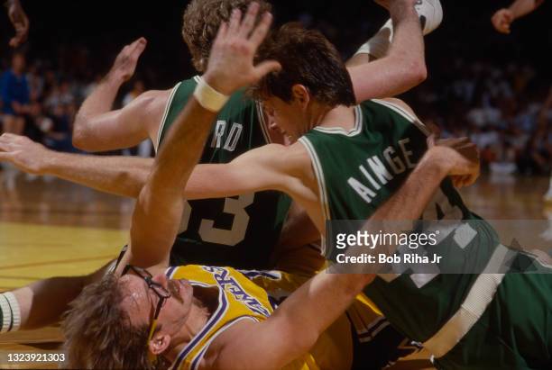 Los Angeles Lakers Kurt Rambis and Boston Celtics Danny Ainge and Larry Bird all end up on floor during 1985 NBA Finals game action between Los...