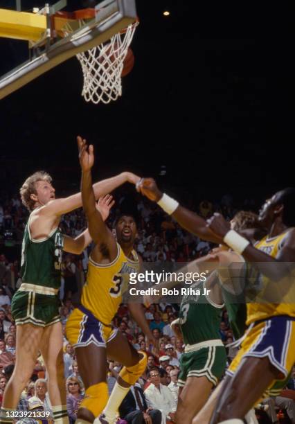 Boston Celtics Larry Bird battles Los Angeles Lakers Magic Johnson for rebound during 1985 NBA Finals between Los Angeles Lakers and Boston Celtics,...