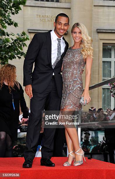 Football player Theo Walcott and Melanie Slade attend the "Harry Potter And The Deathly Hallows Part 2" world premiere at Trafalgar Square on July 7,...