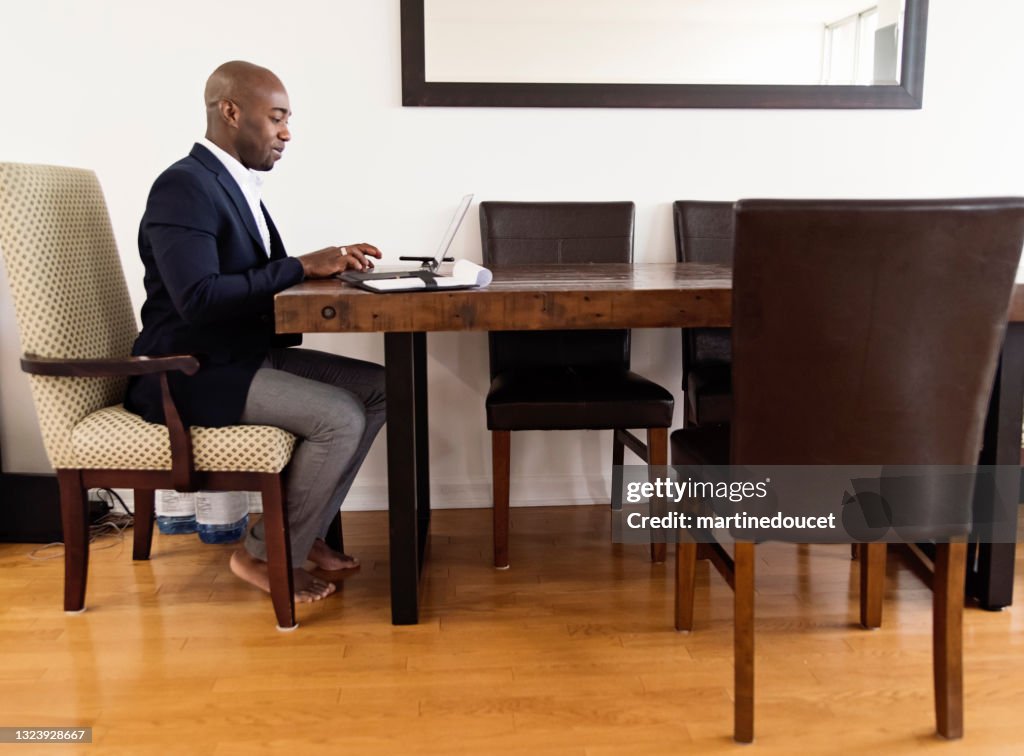 Mature African-American man working from home.