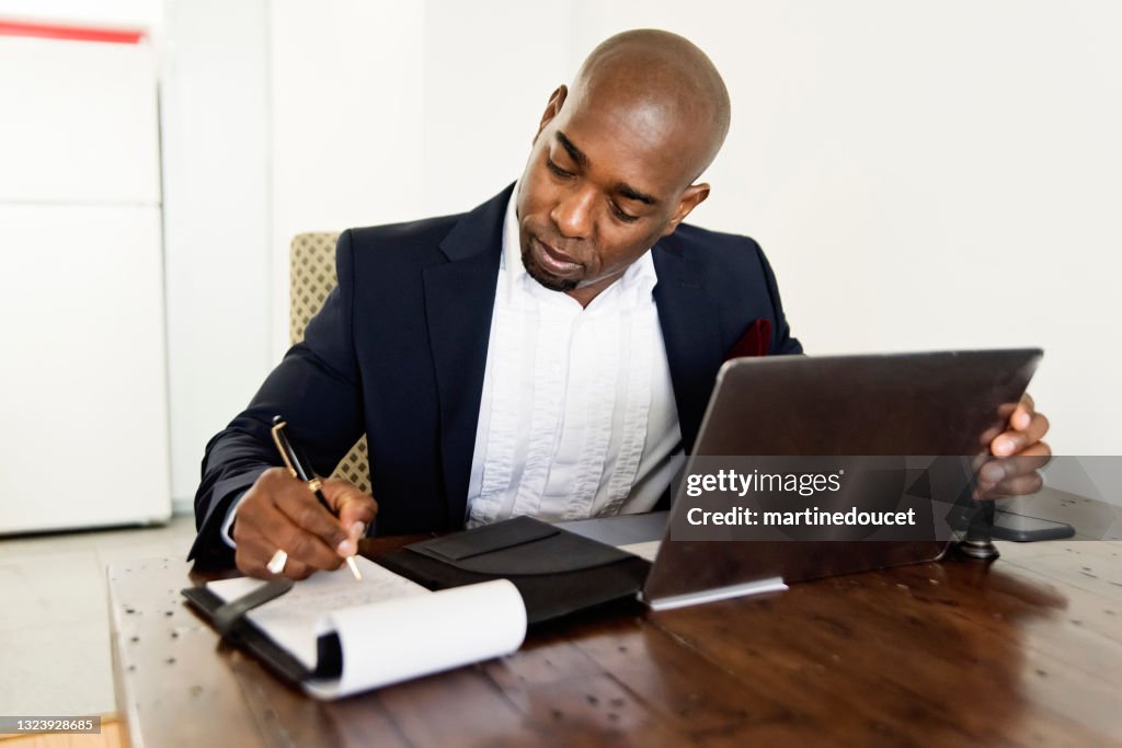 Mature African-American man working from home.