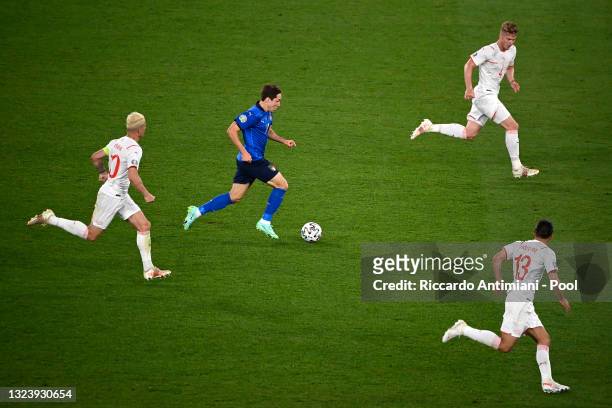 Federico Chiesa of Italy makes a break during the UEFA Euro 2020 Championship Group A match between Italy and Switzerland at Olimpico Stadium on June...