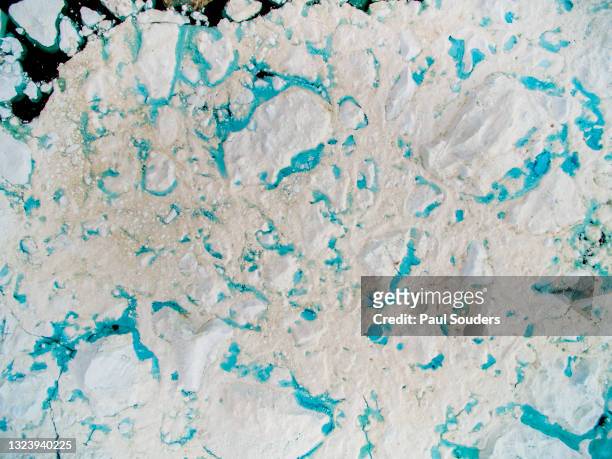 aerial view of melting icebergs in jakobshavn icefjord, ilulissat, greenland - iceberg above and below water stock pictures, royalty-free photos & images