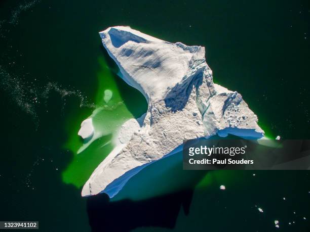 aerial view of melting iceberg in disko bay, ilulissat, greenland - iceberg above and below water stock pictures, royalty-free photos & images