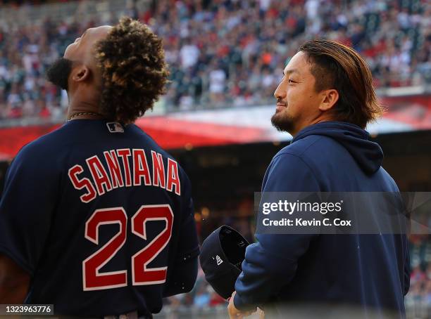 Hirokazu Sawamura of the Boston Red Sox laughs with Danny Santana prior to facing the Atlanta Braves at Truist Park on June 16, 2021 in Atlanta,...