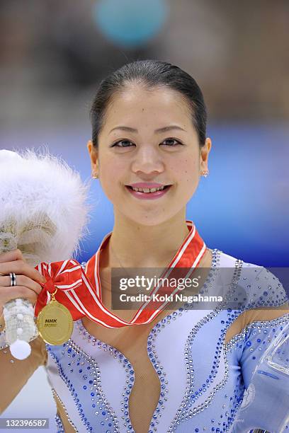 Akiko Suzuki of Japan poses for photograghs in the women's singles during day two of the ISU Grand Prix of Figure Skating NHK Trophy at Makomanai...