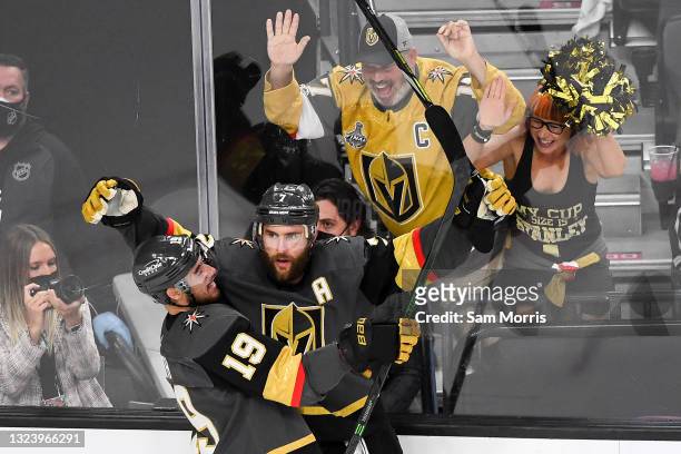 Alex Pietrangelo of the Vegas Golden Knights is congratulated by Reilly Smith after scoring a goal against the Montreal Canadiens during the third...