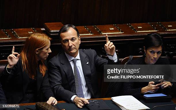 Italy's minister Michela Vittoria Brambilla, foreign minister Franco Frattini and education minister Mara Carfagna react at the parliament during a...