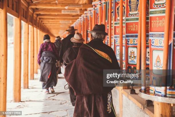 tibetan buddhists at labrang monastery - srinagar daily life stock pictures, royalty-free photos & images