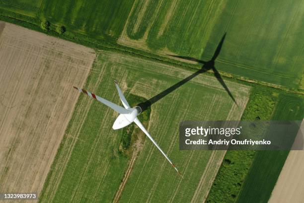 aerial view of wind turbine - industry nature stock pictures, royalty-free photos & images