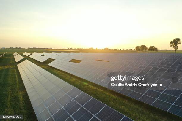 aerial view of solar power station and solar energy panels - zonnecellen stockfoto's en -beelden