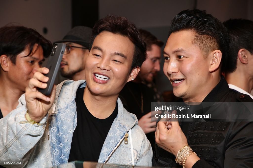 Kane Lim and Kyle Chan pose with a diamond ring at Kyle Chan's Retail