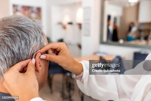 hearing aid - hearing aids stock pictures, royalty-free photos & images