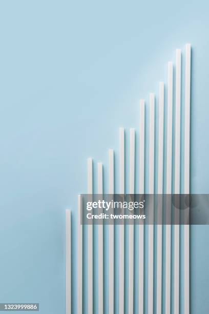 row of ascending white lines on blue background. - simple line graph stock pictures, royalty-free photos & images