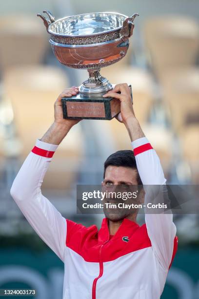 June 13. Novak Djokovic of Serbia with the winners trophy after his victory against Stefanos Tsitsipas of Greece on Court Philippe-Chatrier during...