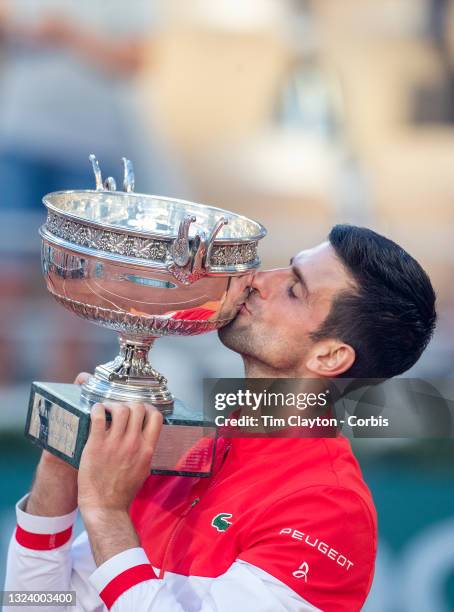 June 13. Novak Djokovic of Serbia with the winners trophy after his victory against Stefanos Tsitsipas of Greece on Court Philippe-Chatrier during...