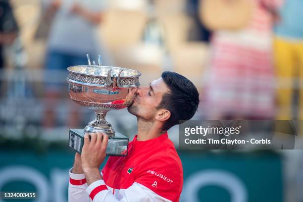 June 13. Novak Djokovic of Serbia with the winners trophy after his victory against Stefanos Tsitsipas of Greece on Court Philippe-Chatrier during...