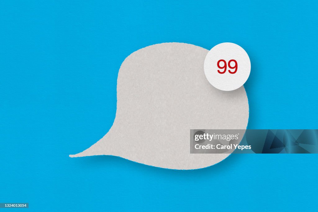 Grey felt speech bubble with a white circle and the number 99 against a blue background.
