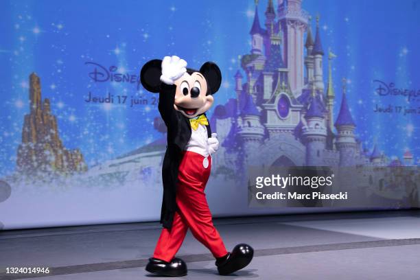 Mickey Mouse joins Natacha Rafalski, President of Disneyland Paris, Euro Disney Sca as she gives a speech as Disneyland Paris parks reopen on June...
