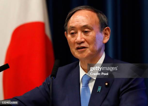 Japan's Prime Minister Yoshihide Suga attends a news conference on Japan's response to the coronavirus disease outbreak at his official residence on...