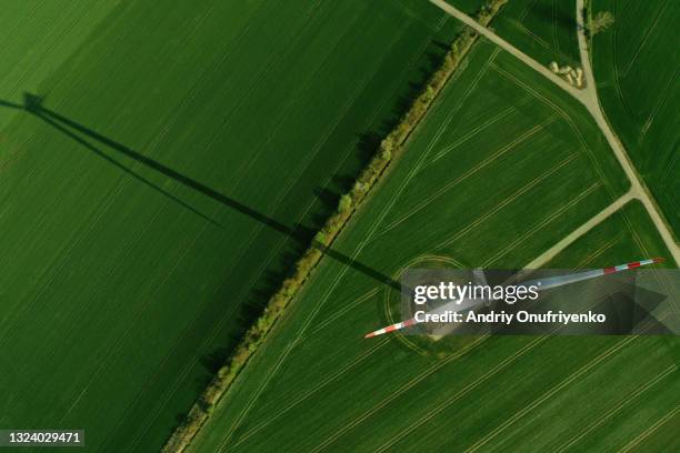 aerial view of wind turbine - edificio agrícola fotografías e imágenes de stock