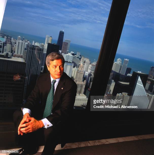 Portrait of American businessman and CEO Jamie Dimon as he poses in front of a picture window in his office, Chicago, Illinois, 2003 or 2004.