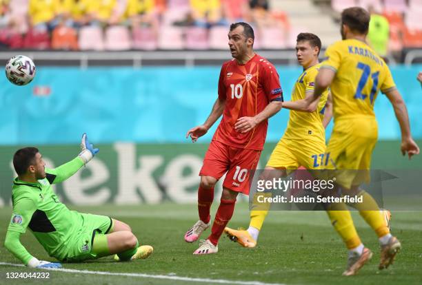 Goran Pandev of North Macedonia scores a goal past Georgiy Bushchan of Ukraine that was later disallowed for offside during the UEFA Euro 2020...