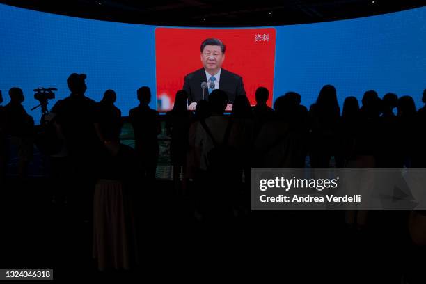 Chinese President Xi Jinping is seen on the screen during a presentation of Lingang Special Area of China, Pilot Free Trade Zone to the press during...