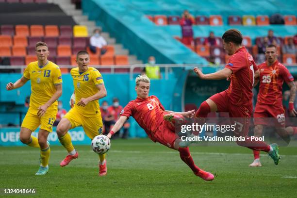 Egzijan Alioski of North Macedonia scores their side's first goal after having a penalty saved by Georgiy Bushchan of Ukraine during the UEFA Euro...