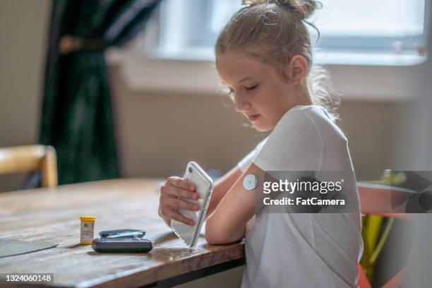 at home diabetes technology - childhood diabetes stock pictures, royalty-free photos & images