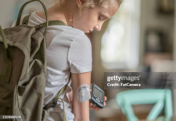 on the go diabetes technology - insulin pump stock pictures, royalty-free photos & images