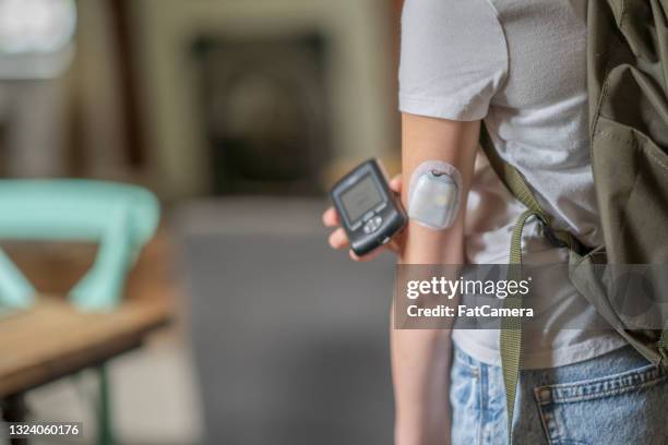 on the go diabetes technology - childhood diabetes stock pictures, royalty-free photos & images