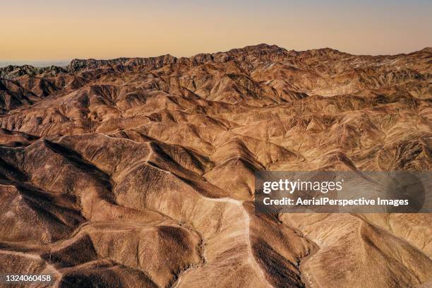 aerial view of mountains - extremlandschaft stock-fotos und bilder