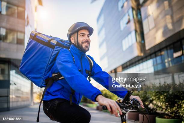 food delivery man - gig economy stock pictures, royalty-free photos & images