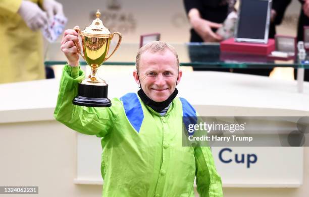 Jockey Joe Fanning celebrates with the Gold Cup after winning on board Subjectivist on Day Three of the Royal Ascot Meeting at Ascot Racecourse on...