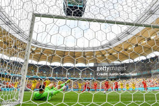 Egzijan Alioski of North Macedonia scores their side's first goal after having a penalty saved by Georgiy Bushchan of Ukraine during the UEFA Euro...