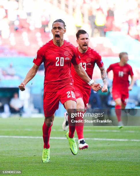 Yussuf Poulsen of Denmark celebrates after scoring their side's first goal during the UEFA Euro 2020 Championship Group B match between Denmark and...