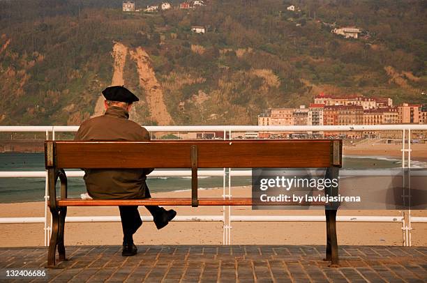 man sitting on bench - beret stock pictures, royalty-free photos & images