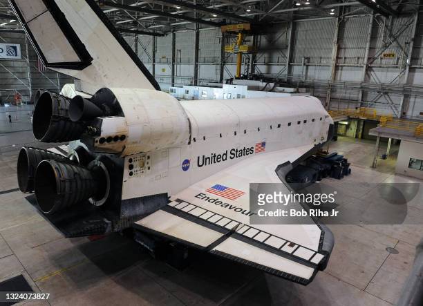 Space shuttle orbiter Endeavour sits inside the United Airlines hanger at Los Angeles International Airport waiting for its final journey to the...