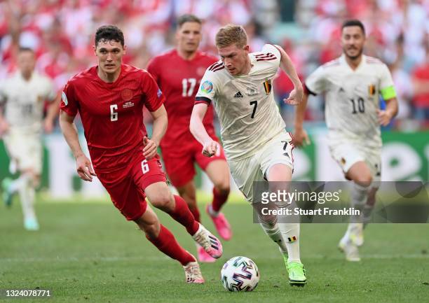 Kevin De Bruyne of Belgium runs with the ball whilst under pressure from Andreas Christensen of Denmark during the UEFA Euro 2020 Championship Group...