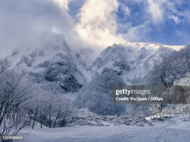 scenic view of snow covered mountains against sky,daisen,japan - tottori prefecture stock pictures, royalty-free photos & images
