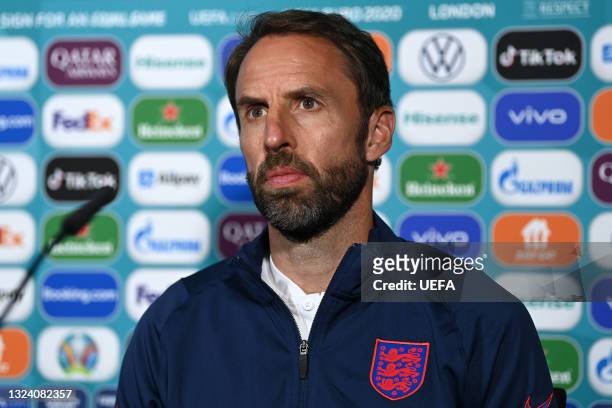 In this handout picture provided by UEFA, Gareth Southgate, Head Coach of England speaks to the media during the England Press Conference ahead of...