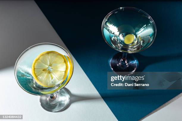 blue cocktails with lemon and grape - cocktail isolated stock pictures, royalty-free photos & images