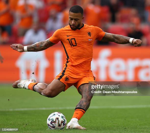 Memphis Depay of Netherlands scores their side's first goal from the penalty spot during the UEFA Euro 2020 Championship Group C match between the...
