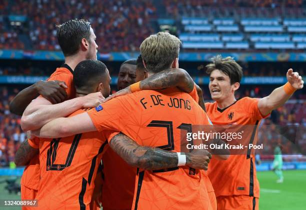 Memphis Depay of Netherlands celebrates with team mates after scoring their side's first goal during the UEFA Euro 2020 Championship Group C match...