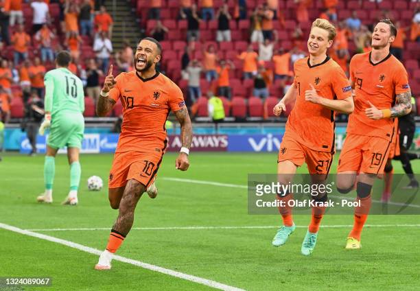Memphis Depay of Netherlands celebrates after scoring their side's first goal during the UEFA Euro 2020 Championship Group C match between the...