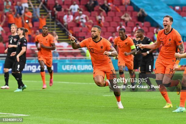 Memphis Depay of Netherlands celebrates after scoring their side's first goal during the UEFA Euro 2020 Championship Group C match between the...